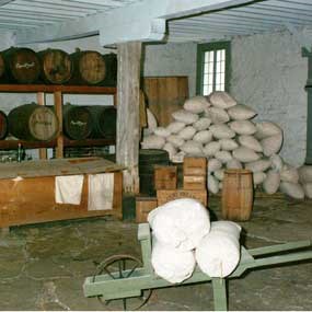 interior of Commissary with exhibit showing containers used by army when the building was a food supply warehouse
