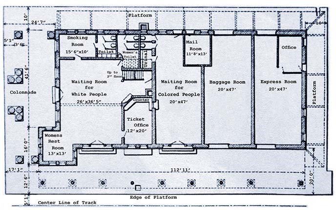 Blue and white floor plan of train station.