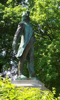 bright green trees and leaves surround a copper statue, it does now shine, it has turned green; but the man it shows stands tall and proud saluting all he sees bright green trees and leaves surround a copper statue, it does now shine, it has turned green; but the man it shows stands tall and proud saluting all he sees