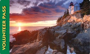 Volunteer Pass 2011, a purple rocky shoreline at sunset. Orange light bounces off the clouds
