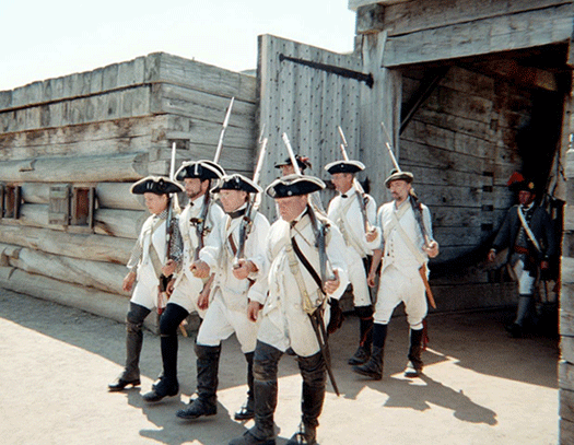 everything is a tone of grey white and light brown. soldiers in line, the fading fort walls, the shiny bayonets and the shadows cast on the ground. everything is a tone of grey white and light brown. soldiers in line, the fading fort walls, the shiny bayonets and the shadows cast on the ground.