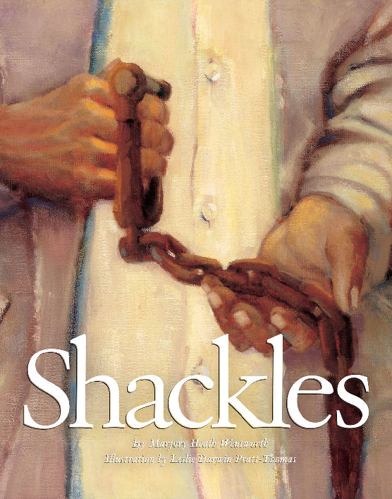 Cover of the book "Shackles' with a person holding a pair of slave shackles.