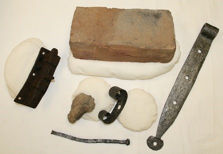 Artifacts arranged on white backing.