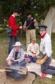 Re-enactment of sons and daughters of trappers at expedition campsite.