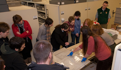 Field school students examine artifacts in the Fort Vancouver collection facility.