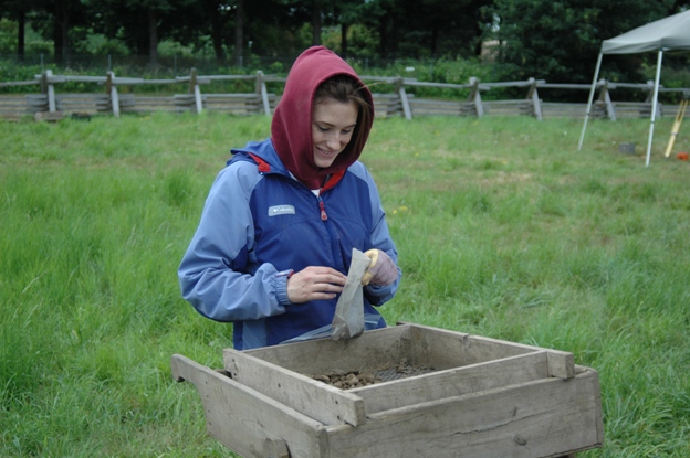 A student screens for artifacts during the 2011 Public Archaeology Field School