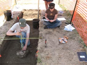 students at an archaeology dig