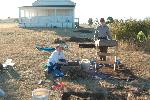 NCRI Archaeologist Cheryl Paddock and a volunteer screen for artifacts at American Camp in San Juan Island National Historical Park