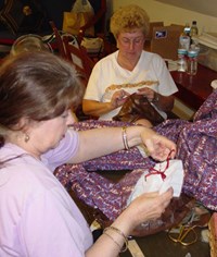 Image of volunteers sewing