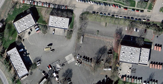 Aerial color photograph of portions of South Vancouver Barracks, showing (left to right) Buildings 400, 402, 404, and 405.