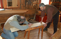 Staff working inside the Carpenters' Shop