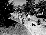 Photograph taken in the 1920s of community members pitching in to repair the grounds of Cedar Hill.