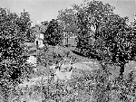 Community members work to repair Cedar Hill grounds. Photograph taken in the 1920s.