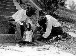 Men repair steps that lead up to the front entrance of Cedar Hill in the 1920s.