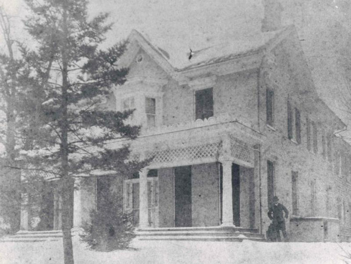 Man Standing by House