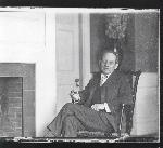 FL Olmsted, Jr. sitting in the parlor at Fairsted
