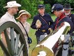 Visitors mingling cannon crew