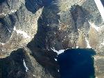 Granite peaks surround a cirque lake.