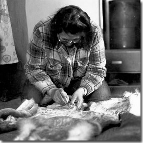 Nunamiut woman working with caribou hide (Anchorage Museum of History and Art, Ward W. Wells Collection, WWS-5122B)