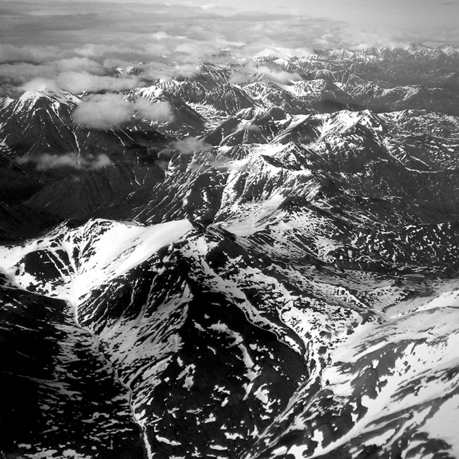 Aerial photo of the Brooks Range with snow in black and white