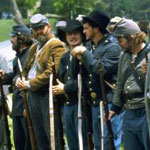 Costumed soldiers at a Civil War battle reenactment.