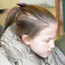 A Junior Ranger gets ready to look through a microscope.
