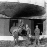 Soldiers pose with 12 inch gun that shot 1,080 pound projectiles.