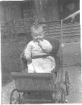 Baby in carriage on Officers Row, c. 1920