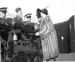 Lana Turner signs projectile in WWII.