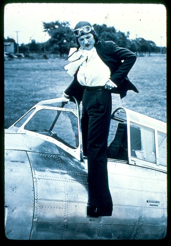 Female pilot coming out of plane