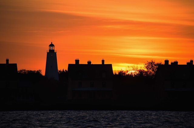 Officers Row and the Sandy Hook Lighthouse at sunset. Photo by Volunteer-in-Parks Stan Kosinski.