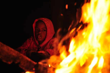 Youth enjoying a campfire.