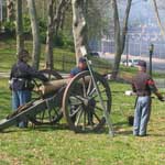 Re-enactors demonstrate how to fire a cannon
