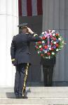 Saluting before memorial wreath