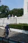 Workers prepare the cap stone for removal