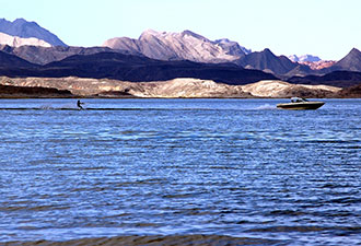 Photo: A study in contrasts -- waterskiing with a desert view. 