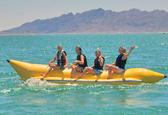 boaters on a banana-shaped raft 