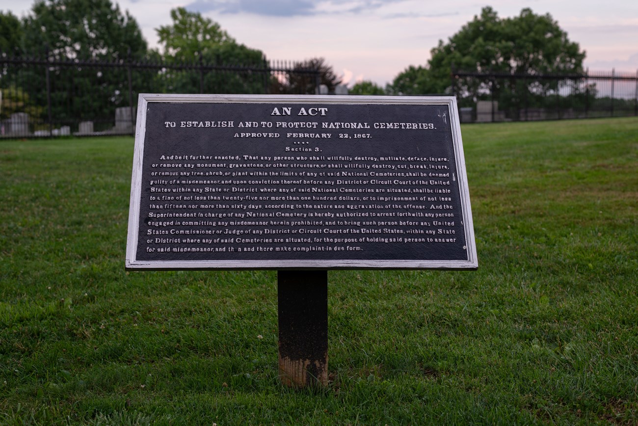 Sign that reads :An act to establish and to protect national cemeteries" with smaller text of the act underneath.