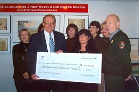 Bob Wilburn of the Gettysburg Foundation accepts check from Alcoa Foundation representatives, Nov. 16. Bob Wilburn of the Gettysburg Foundation accepts check from Alcoa Foundation representatives, Nov. 16.