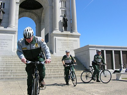 Park law enforcement officers on bikes.