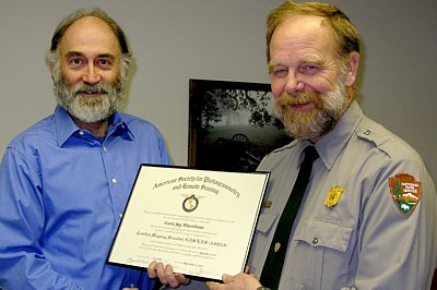 Curt Musselman and Superintendent Latschar with award