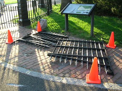 Destroyed gate to cemetery