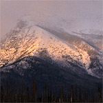 Alpenglow on a snowy mountain