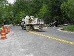 Striping new pavement at Avlanche Creek