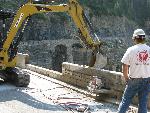 Cutting concrete wall below Triple Arches