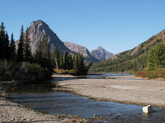 Picture of the inlet to Pray Lake with Sinopah and Lone Walker mountains in the background