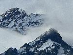 Jagged mountains wrapped in clouds