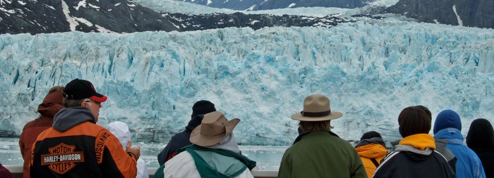 Ranger and visitors viewing glaciers Ranger and visitors viewing glaciers