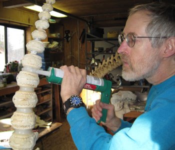 Lee Post adds silicone cartilage to a section of whale vertebrae.