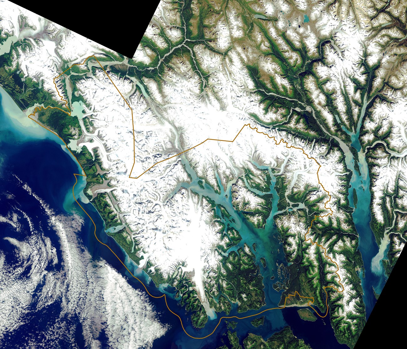 Satellite image of glacier bay with outline of the park and preserve visible.